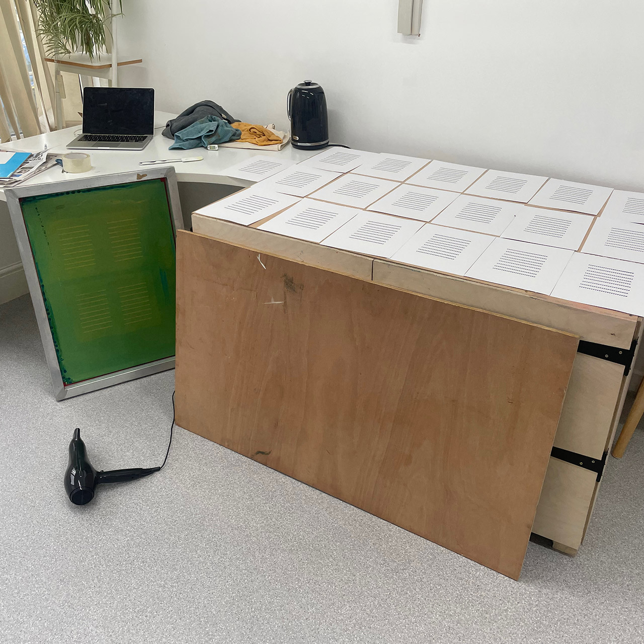 Prints drying on top of drying cupboard